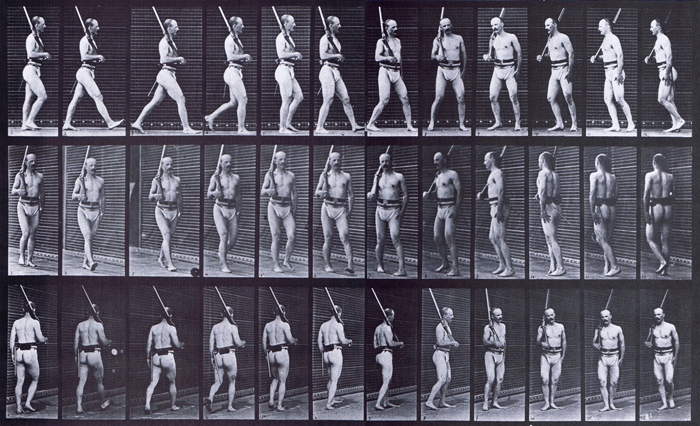 Profile, front three-quarter, and rear three-quarter views of semi nude male wearing underwear with rifle, walking guard and turning around animation reference using muybridge plate 355 from animal locomotion